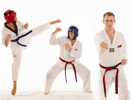 Adult students practicing advanced forms in a professional dojang, recognized for offering the best adults Taekwondo classes in Toronto.